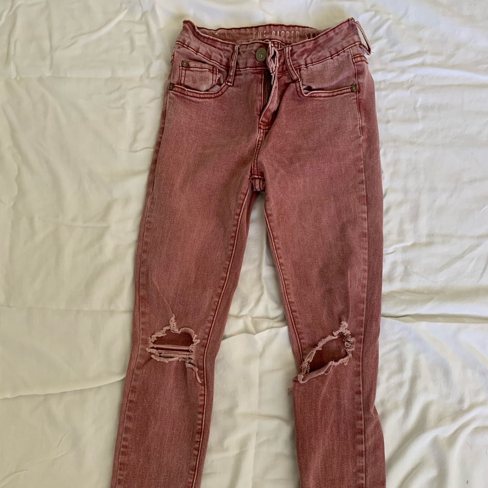 Red washed, ripped skinny jeans